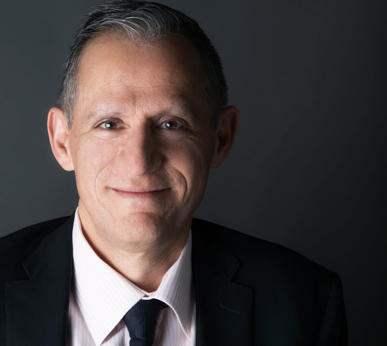 default-2927 A head and shoulders image of a man with a suit and tie.