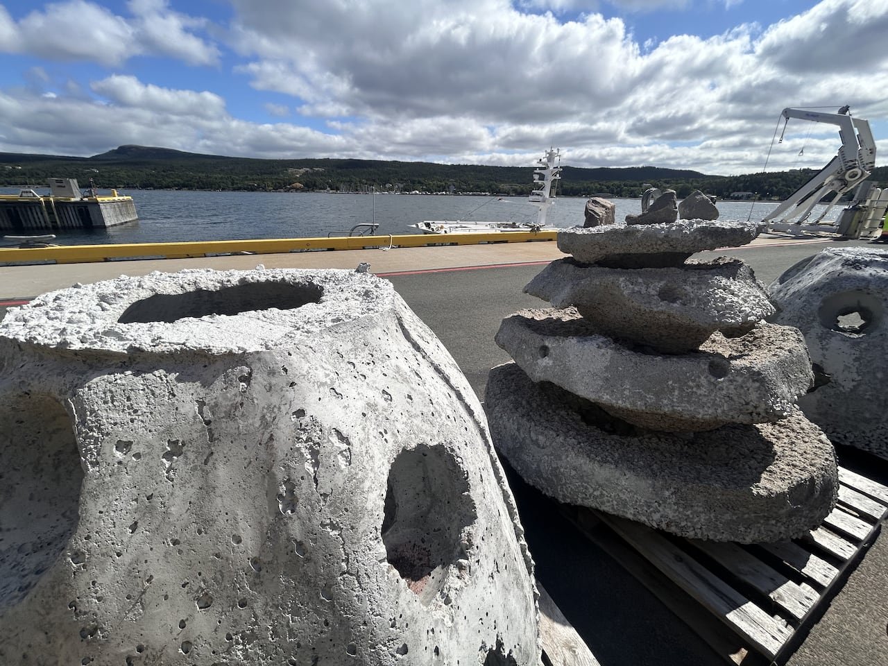 Two concrete structures on a wharf.