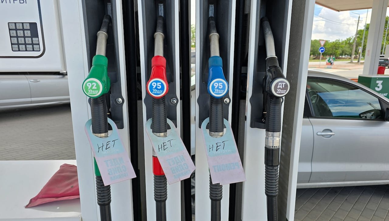 Signs displaying "no" hang from fuel pump nozzles at a gas station in Yevpatoriya, Crimea.