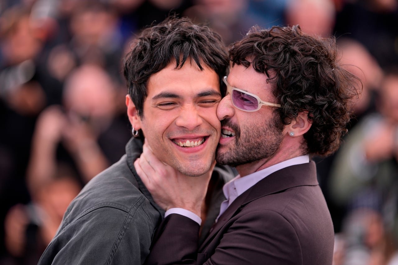 Director Jordan Firstman embraces Diego Calva on the red carpet at Cannes.