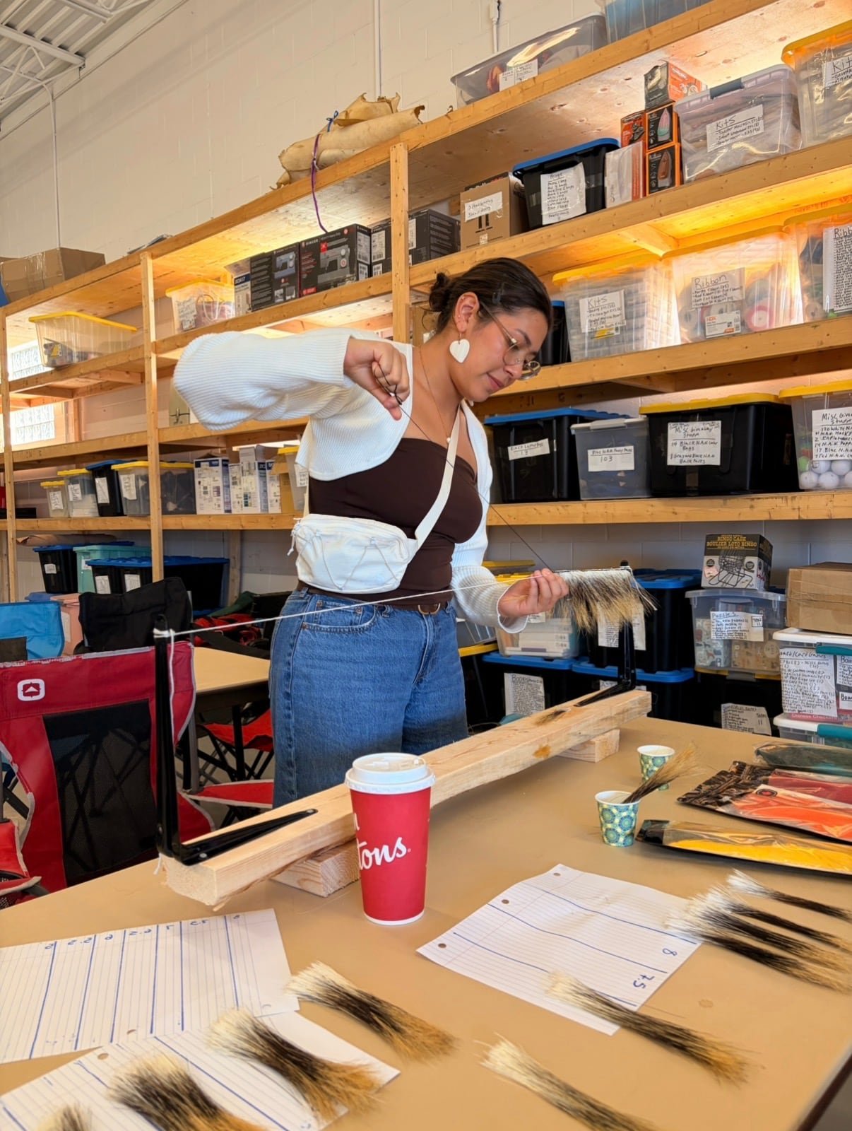 Tisha Duncan crafting a regalia item for the Wabinoong Regalia Collective