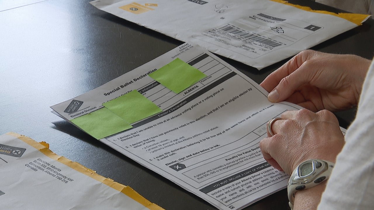A woman reviewing documents.