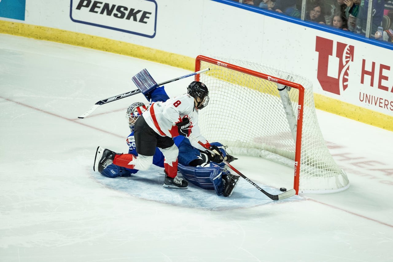 default-411 A hockey player scores a goal.