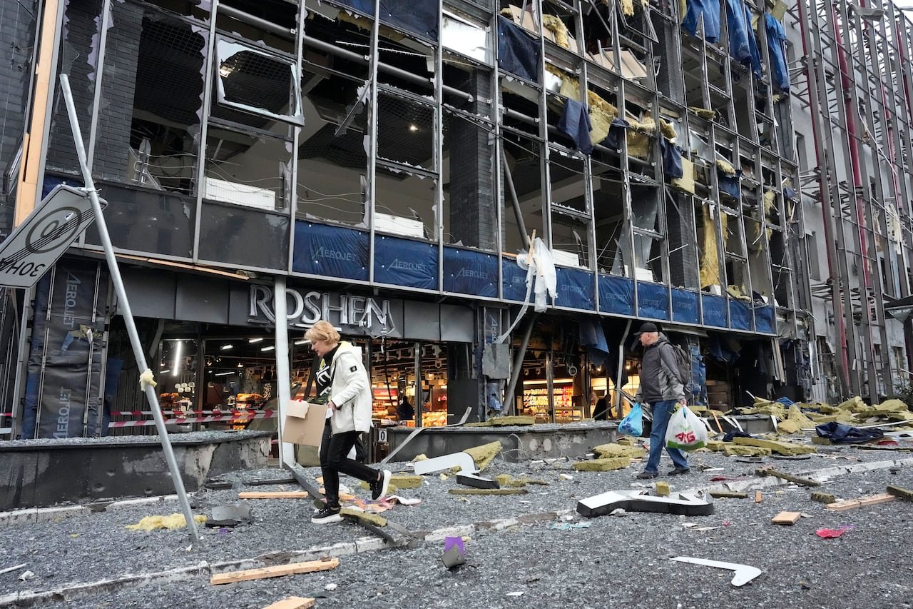People leaving their office in Kyiv, Ukraine, in the aftermath of a Russian air attack.