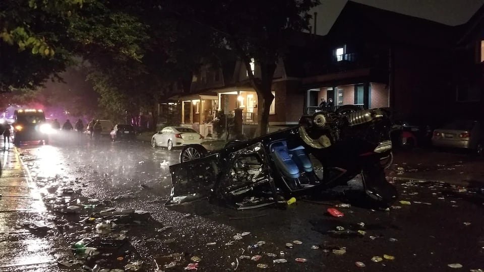 default-551 A vehicle flipped in a dark street.